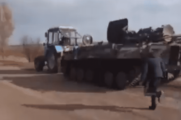 tractor tows tank