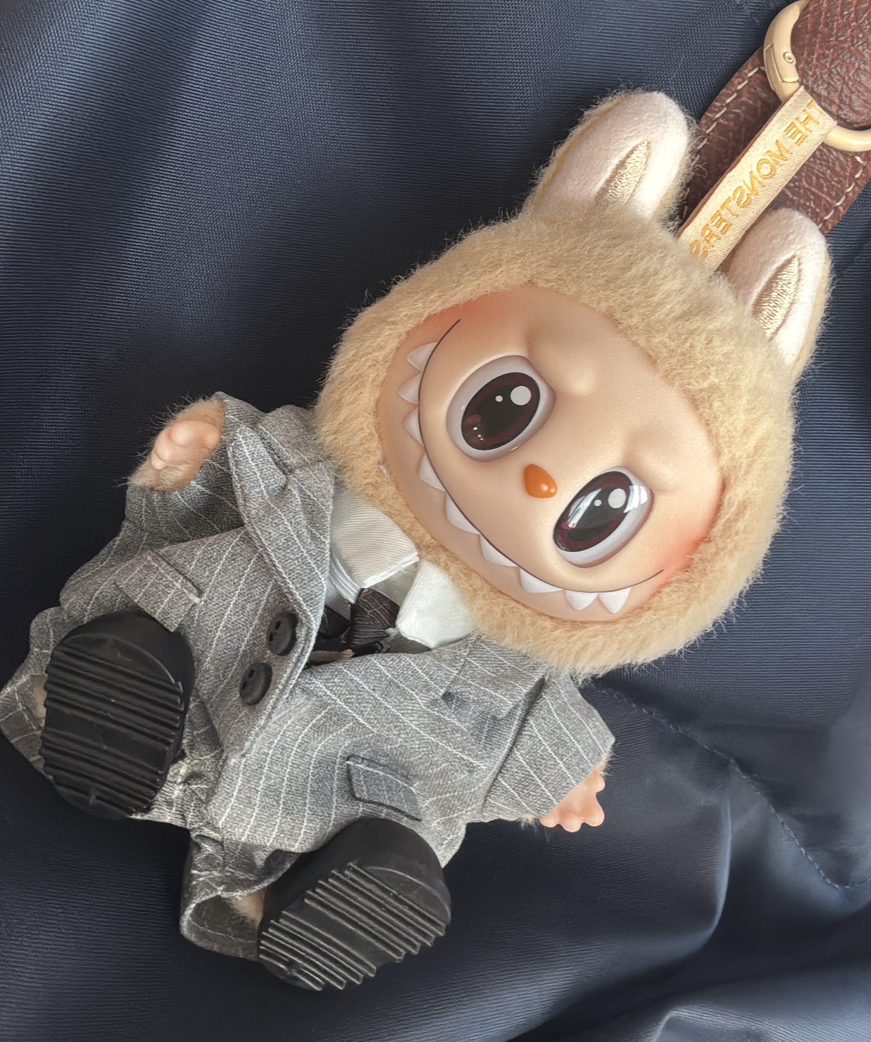 labubu in a grey suit