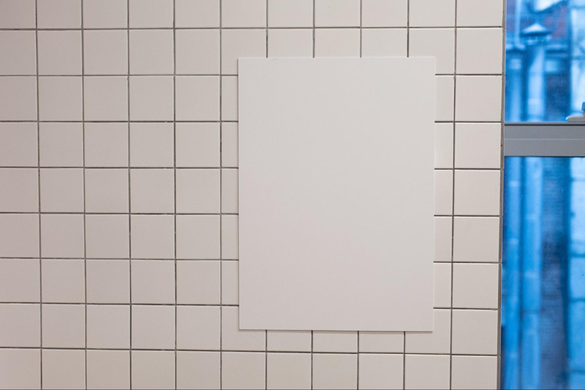 board on bathroom wall