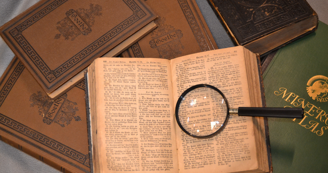 Book and magnifying glass